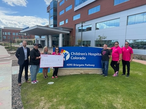 Children's Hospital Colorado receives $10,000 donation from local T-Mobile team.